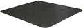 Black 46 x 96 inch water-resistant mat under a dog kennel on a hard floor
