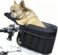 Small dog riding in a mesh front-mount bicycle pet basket