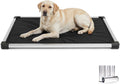 Black padded dog crate pad with aluminum frame inside a wire crate