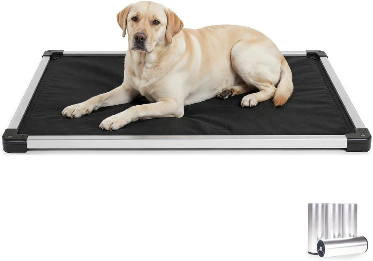 Black padded dog crate pad with aluminum frame inside a wire crate