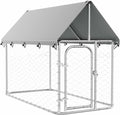 Outdoor dog kennel run with roof cover in a backyard