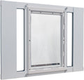 Aluminum sash window pet door panel with large flap installed in a window