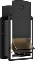 Black steel dog door installed in an exterior wall