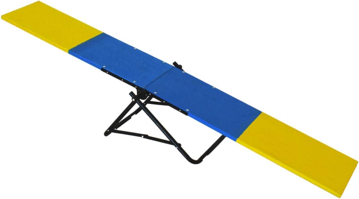 Small dog agility seesaw teeter set up in a backyard