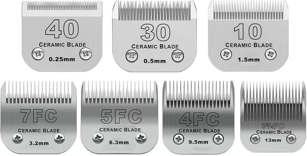 Set of seven ceramic detachable dog grooming clipper blades laid out by size