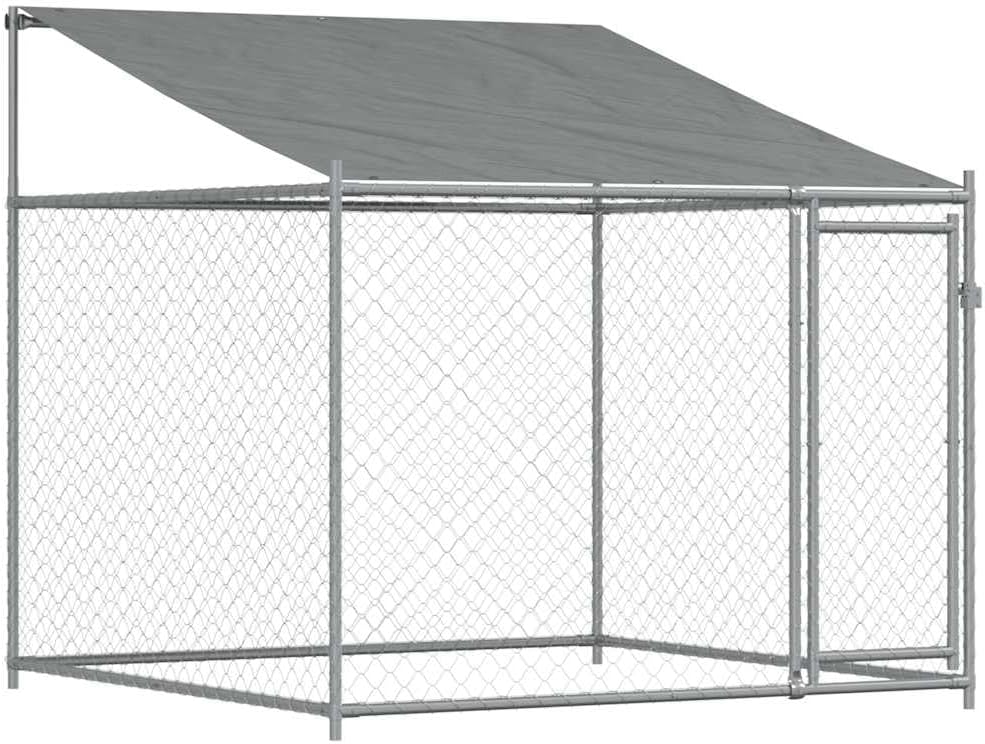 Gray galvanized steel dog cage with roof and door in a garden