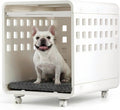Warm white furniture dog crate with clear panels, cushion and wheels