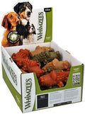 Pile of green alligator-shaped chews for small dogs
