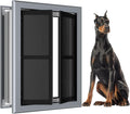 Smoky gray aluminum frame dog door with magnetic flap installed in a wall – view 2