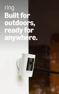 Two white battery-powered outdoor security cameras with mounting brackets