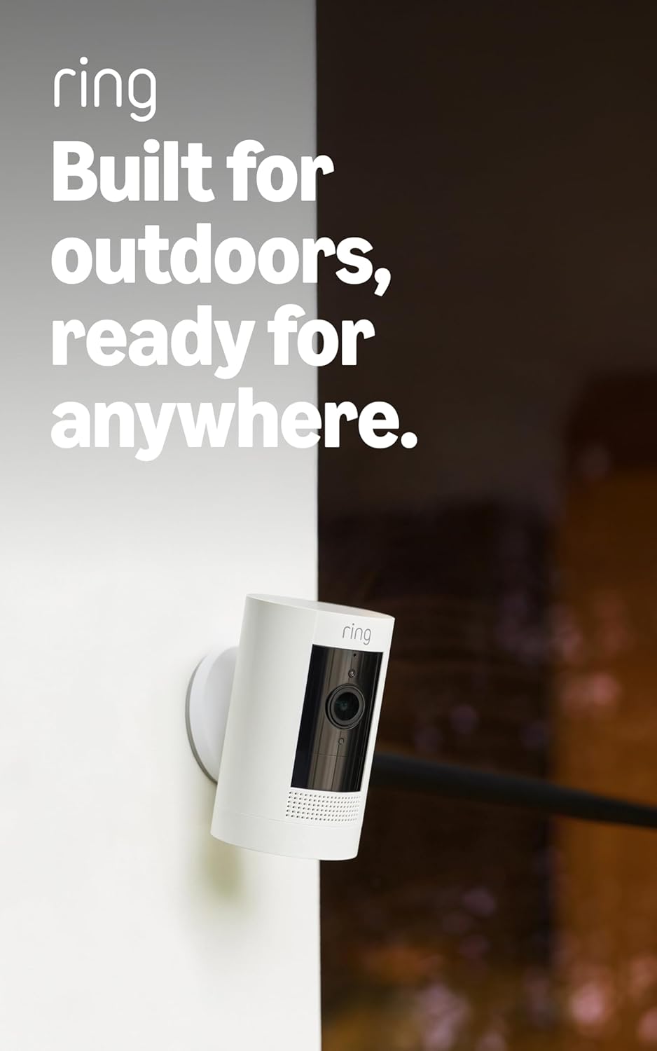 Two white battery-powered outdoor security cameras with mounting brackets