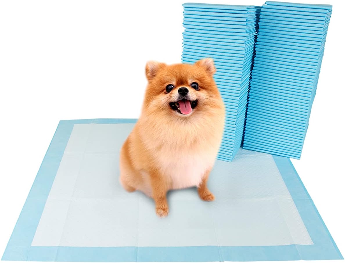 Stack of gray charcoal puppy training pads, one unfolded on the floor – view 3