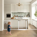 White extra long dog gate spanning a wide indoor doorway