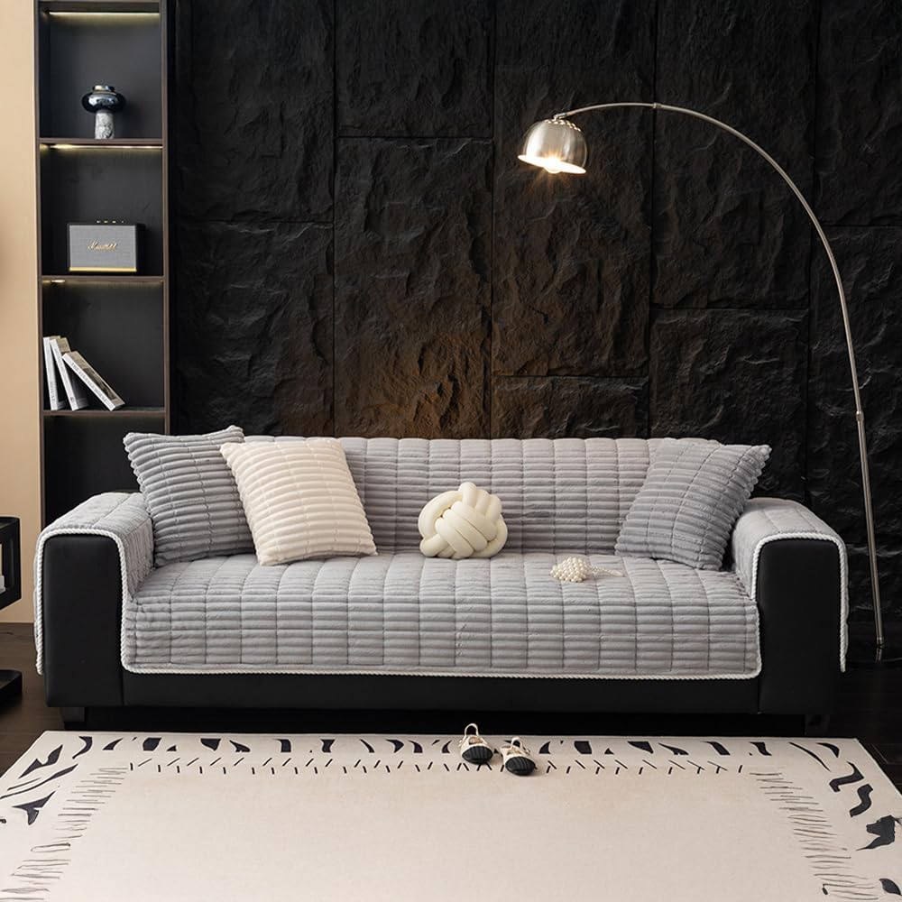 Coffee flannel waterproof pet sofa cover on a three-seat couch