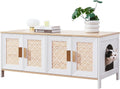 Boho wooden double litter box enclosure with rattan doors used as TV stand