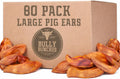 Pile of large whole oven-baked pig ears for dogs