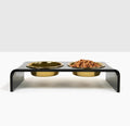 Smoke grey acrylic raised stand holding two gold dog bowls