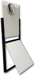 Vertical sliding guillotine dog door with flap installed in a kennel wall