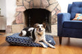 Gray wool-filled dog crate pad with organic cotton canvas cover