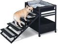 Folding pet stairs with ramp side and storage cabinet beside a bed