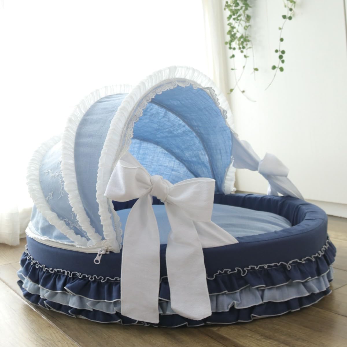 White cotton linen pet bassinet bed with lace canopy and moon pillow