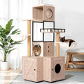 Rustic gray cat tree with litter box enclosure base and scratching posts