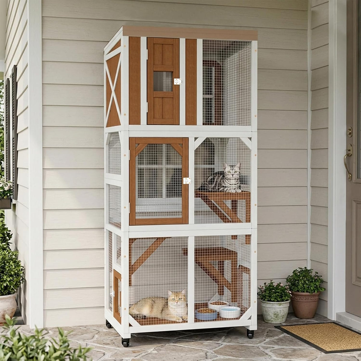 Multi-level outdoor cat enclosure on wheels with playhouse and hanging toys