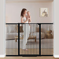 Black extra wide metal pet gate with walk-through door across a wide opening