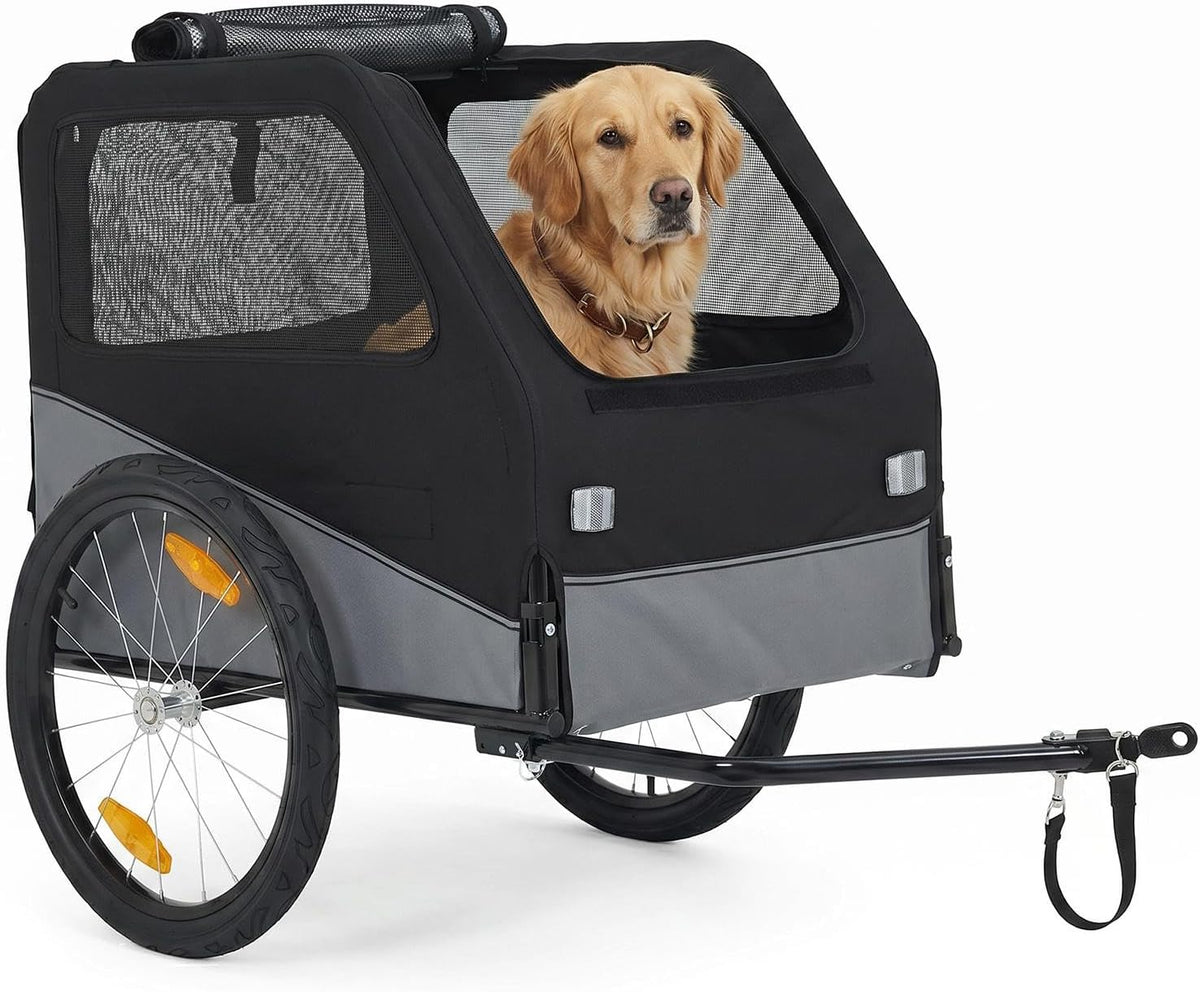 Black collapsible dog bike trailer with mesh windows attached to a bicycle