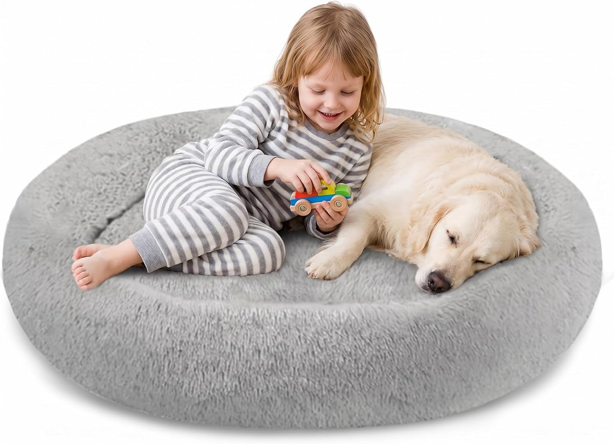 Light grey round plush donut dog bed with raised bolster rim