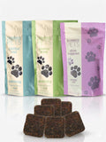 Three jars of dog soft chew supplements for calming, skin and joint support