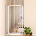 White 55.1 inch extra tall pet gate with small cat door in a hallway