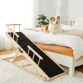 Wooden adjustable dog ramp with side rails leading up to a bed