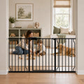 Black extra wide walk-through pet gate in a doorway