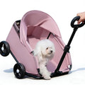 Foldable pet wagon stroller with sun canopy carrying a small dog