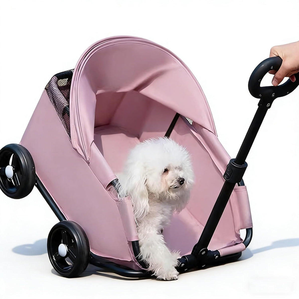 Foldable pet wagon stroller with sun canopy carrying a small dog