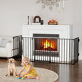 Black 5-panel metal gate configured around a fireplace