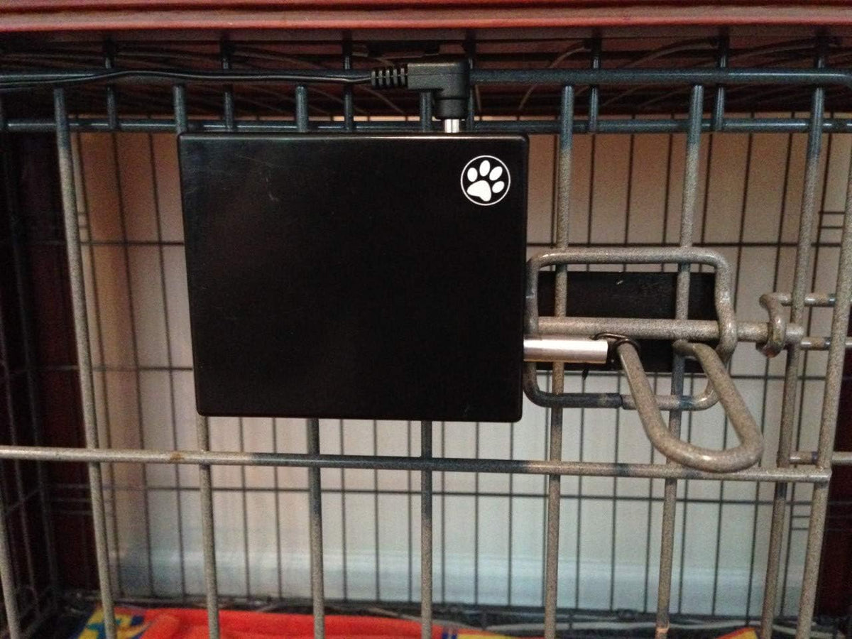 Automatic crate door opener mounted on a wire dog crate with remote control
