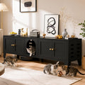 Black cat litter box enclosure cabinet used as a TV stand
