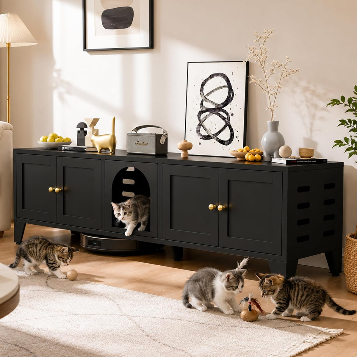 Black cat litter box enclosure cabinet used as a TV stand