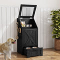 Black dog feeding station cabinet with flip-top food bin and pull-out bowls