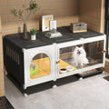 Black pet crate with sliding door, separate toilet area and pull-out potty tray