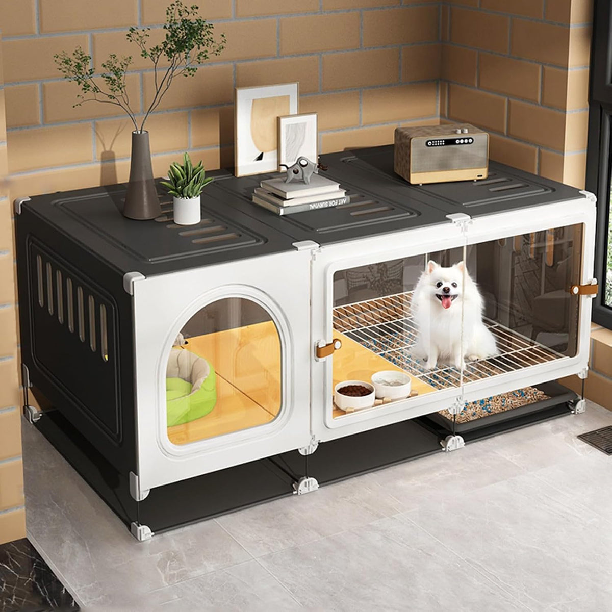 Black pet crate with sliding door, separate toilet area and pull-out potty tray
