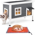 Elevated wooden outdoor cat house with asphalt roof, PVC curtain door and heating pad