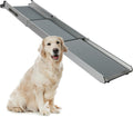 Extended telescoping aluminum dog ramp leading into a pickup truck bed – view 2