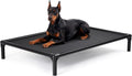 Black XXL elevated dog cot with heavy duty frame on a patio
