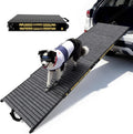 Foldable aluminum dog ramp leading into an SUV
