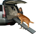Wide tri-fold pet ramp unfolded against a vehicle