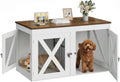 Dog crate furniture with center divider and three doors housing two small dogs