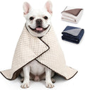 Beige weighted blanket for dogs on a pet bed